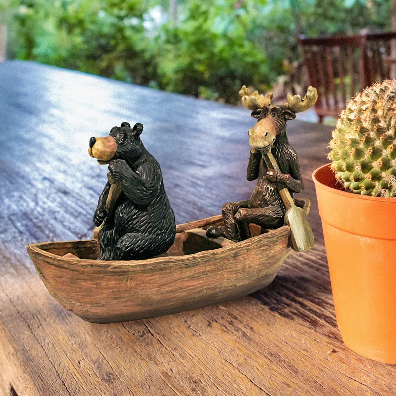 Moose and Black Bear in a Boat Statue